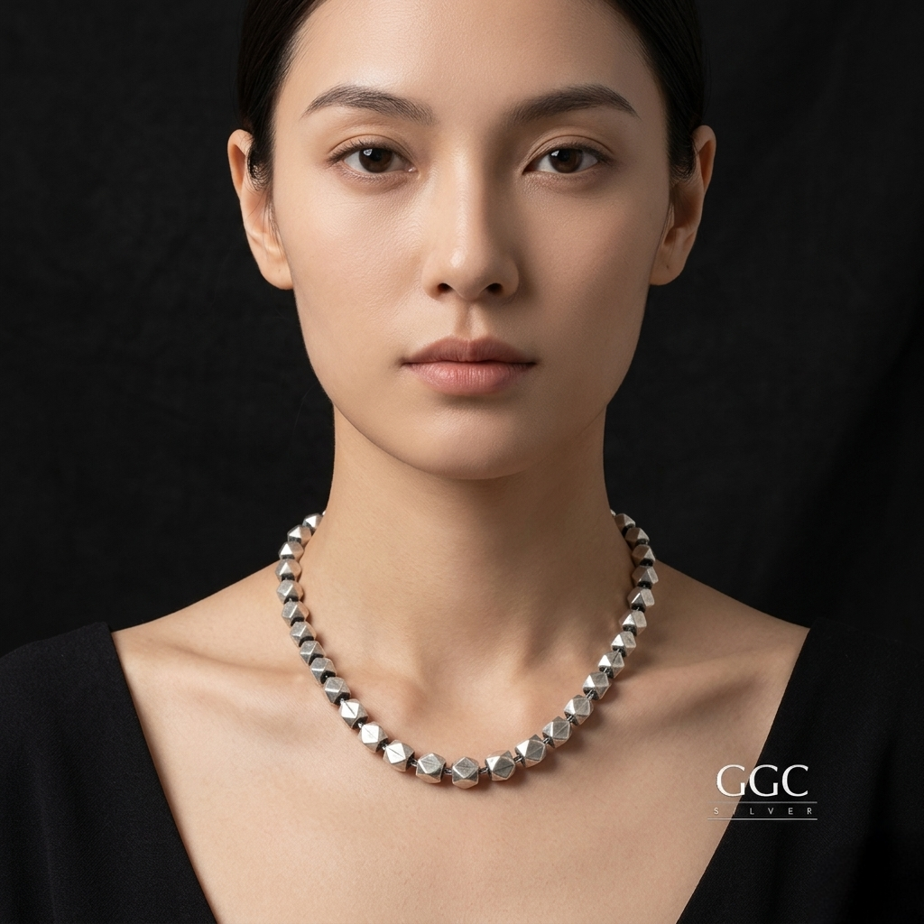 Triangular ball necklace